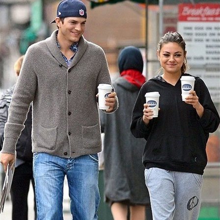 Mila Kunis Both Hands Full