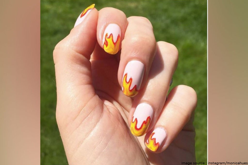 White And Orange Flames Nail Art